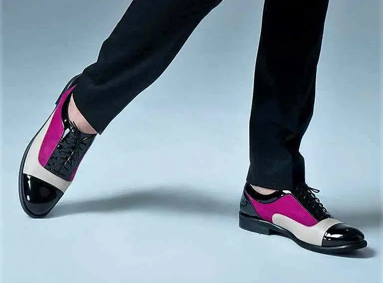 A pair of women's tri-tone lace-up oxford shoes featuring black patent leather, magenta velour leather, and light beige leather panels.